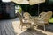 Shaded table and chairs on planked floor before brick enclosure