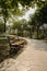 Shaded wayside bench on sunny day