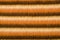 Shades of brown furry striped background. Hairy stripes pattern.