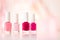 Shades of pink and red nail polish set on glamour background, nailpolish bottles for manicure and pedicure, luxury