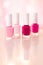 Shades of pink and red nail polish set on glamour background, nailpolish bottles for manicure and pedicure, luxury