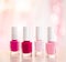 Shades of pink and red nail polish set on glamour background, nailpolish bottles for manicure and pedicure, luxury