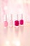 Shades of pink and red nail polish set on glamour background, nailpolish bottles for manicure and pedicure, luxury