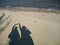 shadow on the beach at noon.