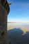 Shadow from the defense tower in the water. Mont Saint Michel Abbey. Spring morning landscape. Normandy, France, Europe