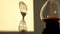 Shadow of an Hourglass measuring the passing time in a countdown to a deadline.