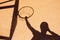 Shadow of male basketball player in slam dunk pose