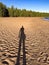 Shadow of man on the beach in Valaam island, Ladoga lake, Karelia