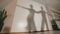 Shadow of man and woman dancing and rehearsing Latin American dance in costumes, slow motion