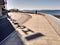 Shadow projected by the sign of a hotel over the seafront in Sanxenxo Galicia Spain.