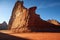 a shadow of a rock formation resembling a dinosaur