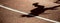 Shadow of a runner on the track.  Sports and healthy lifestyle concept