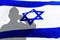Shadow silhouette of a soldier Israel IDF with salutes on flag Israel. Soldier Image for Yom haatzmaut,IsraelI Independence Day