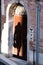 Shadow silhouette of woman in the street door