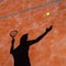 Shadow of a tennis player in action