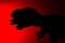 Shadow of tyrannosaurus biting a smaller dinosaur with red light