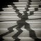 Shadow of a window grille on a staircase