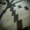 Shadow of a window grille on the stairs