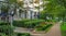 Shadowed passway along the residential building on summer evening time