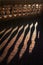 Shadows caused by the evening sunlight shining through balustrades and reflecting on wet concrete