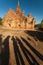 Shadows and contours of people on the background of the temple