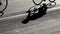 Shadows of cyclists riding on bike during professional race in slow motion