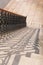 Shadows of decorative cast metal balusters on stone steps