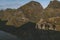 Shadows on the mountain of a group of mountaineers climbing the mountain at sunrise in Lofoten, Norway