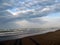 Shadows on sandy beach and Adriatic sea, Rimini, Italy.