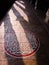 Shadows of temple pillars falling on the stone floors of the ancient Hindu temple of