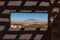 Shadows on wall around around window in viewing platform across Arizona landscape