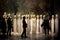 Shadowy people walking past heads of Greek philosophers on pedestals with garden background