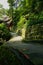 Shady lichen-covered stone path to ancient building on mountains