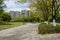 Shady paths before multi-story apartments in sunny summer afternoon