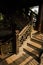 Shady stairway in aged Chinese wooden tower