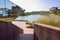 Shady stairway beside lakeside modern building at sunny winter n