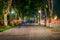 Shady walkway with tropical trees at street of Hanoi at evening.