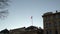 The shaft with the Russian state flag on the peak of gray justice building