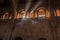 Shafts of light shatter the gloom in a vaulted hall in a fort in Rajasthan, India