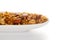\\\'Shahi Mixture\\\' in a white ceramic oval bowl  made almond cashew corn flakes almonds