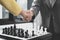 Shake hands, businesswomen two people moving chess in chess competitions demonstrate leadership, followers, and strategic plans,