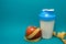 Shaker with protein cocktail Apple and tape measure fitness diet sport life