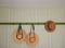 Shaker style wall pegboard rack holding straw hats