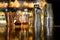 Shakers and copper glass and angostura bitters on counter of the bar