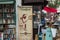 Shakespeare and Company Bookstore banner hangs in front of busy
