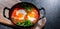 Shakshouka dish in a cast iron pan