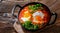 Shakshouka dish in a cast iron pan