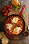 Shakshuka with chickpeas in a skillet