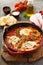 Shakshuka with chickpeas in a skillet