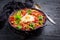 Shakshuka -  dish of eggs poached in a tomato sauce with Feta cheese and coriander